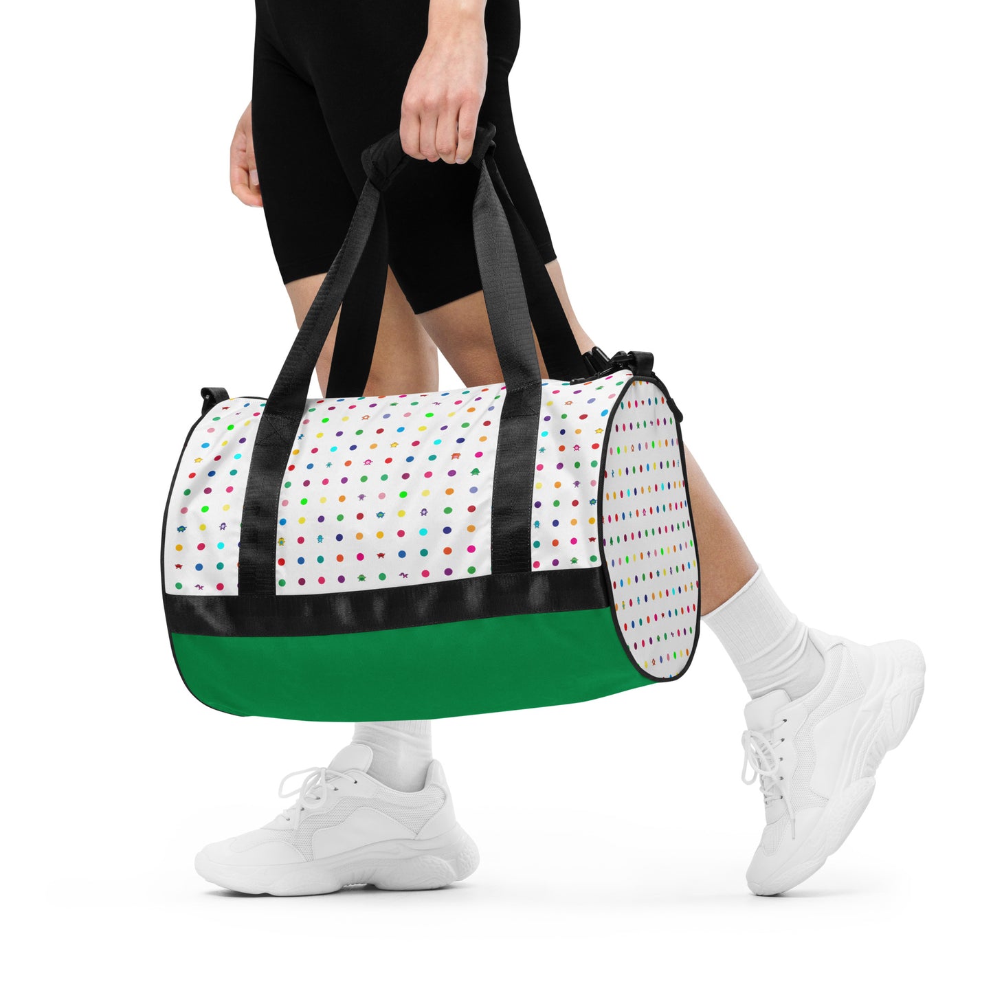 woman holding Kids cute colourful dot graphic print on white gym bag black handles with green bottom